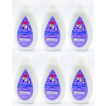 Johnson's Baby Bedtime Lotion 300ml bottle on a nursery shelf beside baby bath products