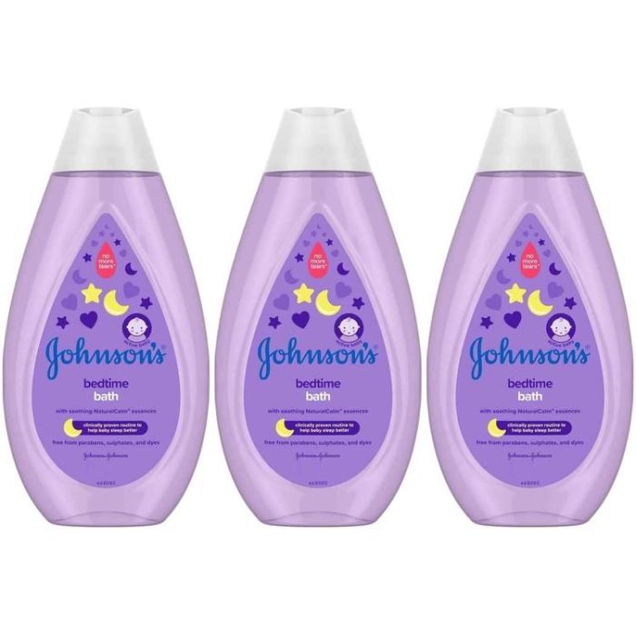 Johnson's Baby Bedtime Bath 300ml bottle on a bathroom shelf next to baby bath toys
