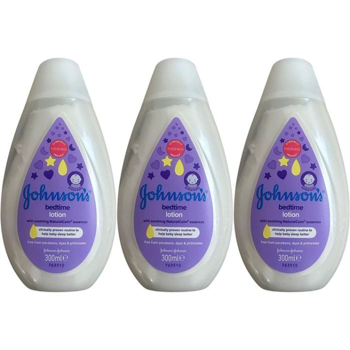 Johnson's Baby Bedtime Lotion 300ml bottle on a nursery shelf beside baby bath products
