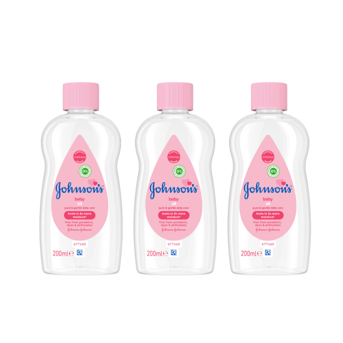 Johnson's Baby Oil Pure and Gentle Care 200ml bottle on a clean nursery shelf

