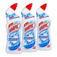 Harpic White & Shine Original Toilet Cleaner Bleach 750ml bottle on a bathroom shelf
