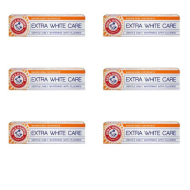 Arm & Hammer Extra White Care Toothpaste 125g tube on a clean bathroom shelf
